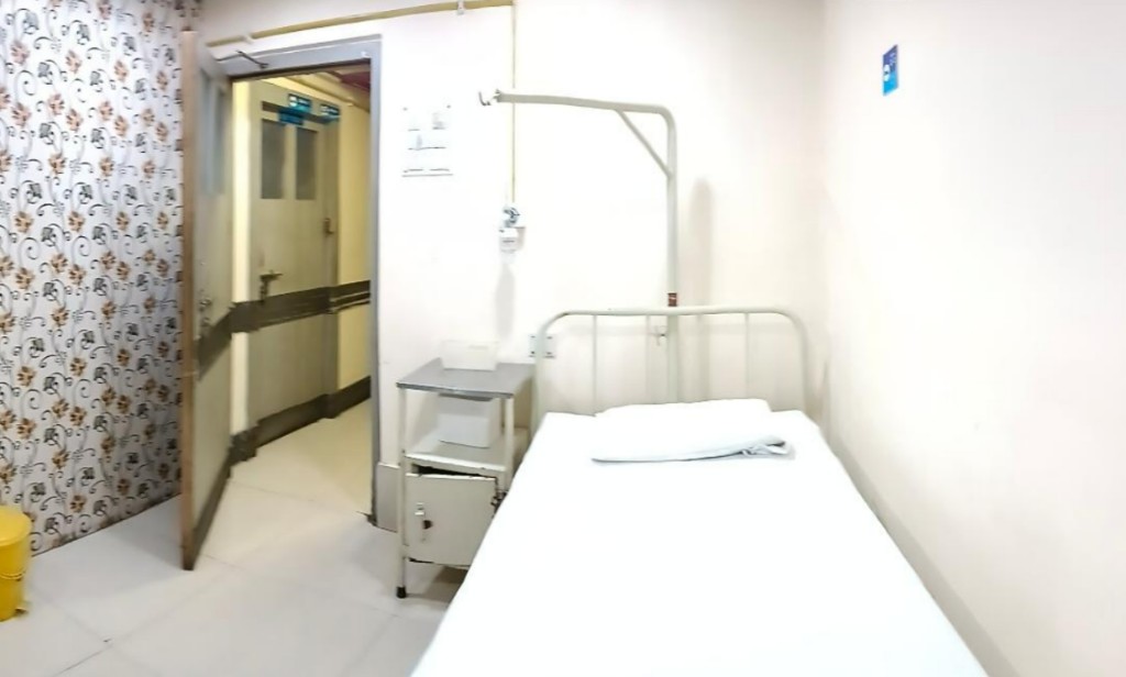 Medicare Nursing Home — single accommodation with hospital bed and centralized oxygen facility